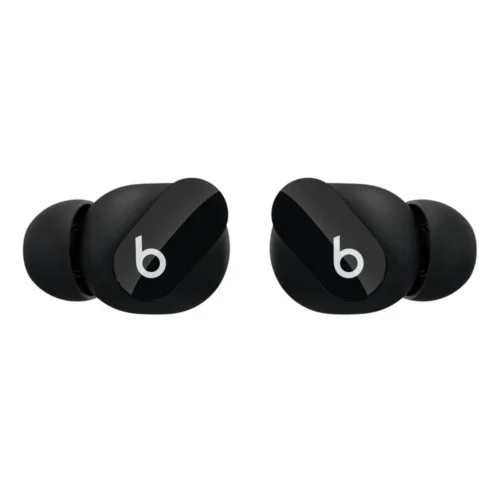 Gros plan sur l'écouteur Beats Studio Bud Noir, soulignant le bouton physique multifonction.