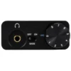 FiiO E10K posé sur un bureau à côté d'un ordinateur portable